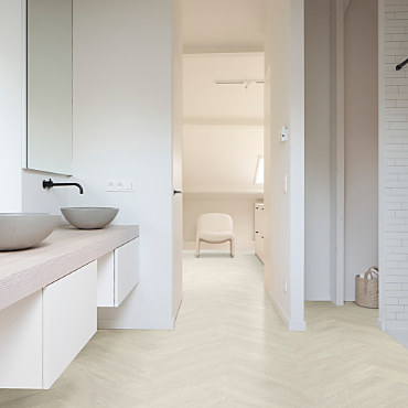 A bathroom with a fitted floor