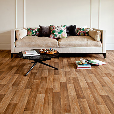 A sitting room with a fitted floor